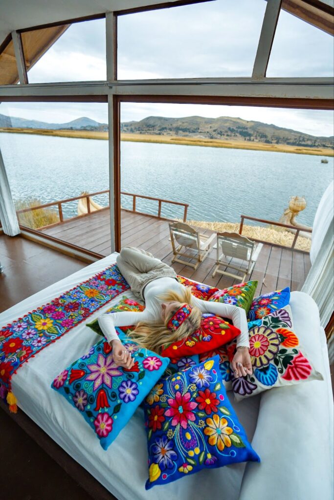 Sky laying on colorful bed on Lake Titicaca Peru