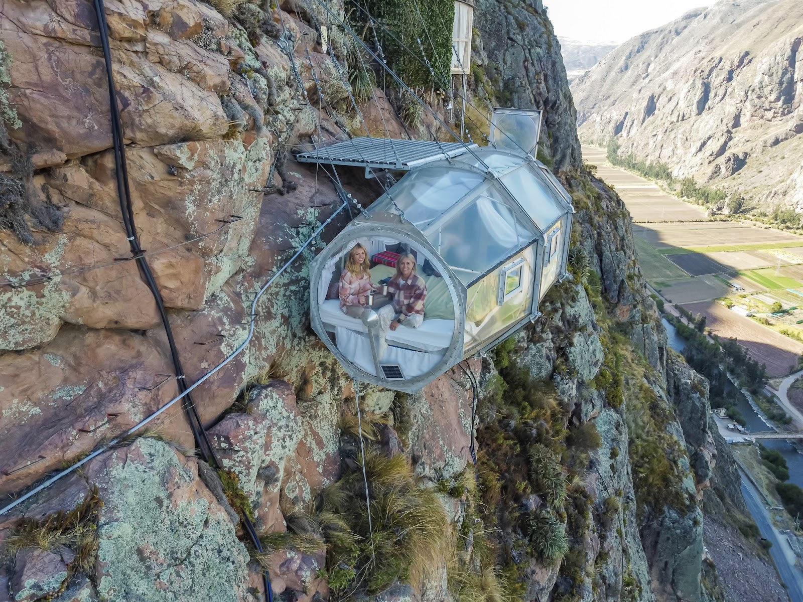 hanging out a skylodge peru in the transparent sleeping pods