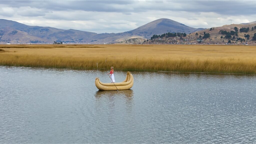 Sky paddling a canoe on Lake Titicaca