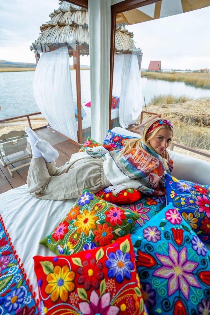 Sky lounging on a bed on the floating islands of Lake Titicaca