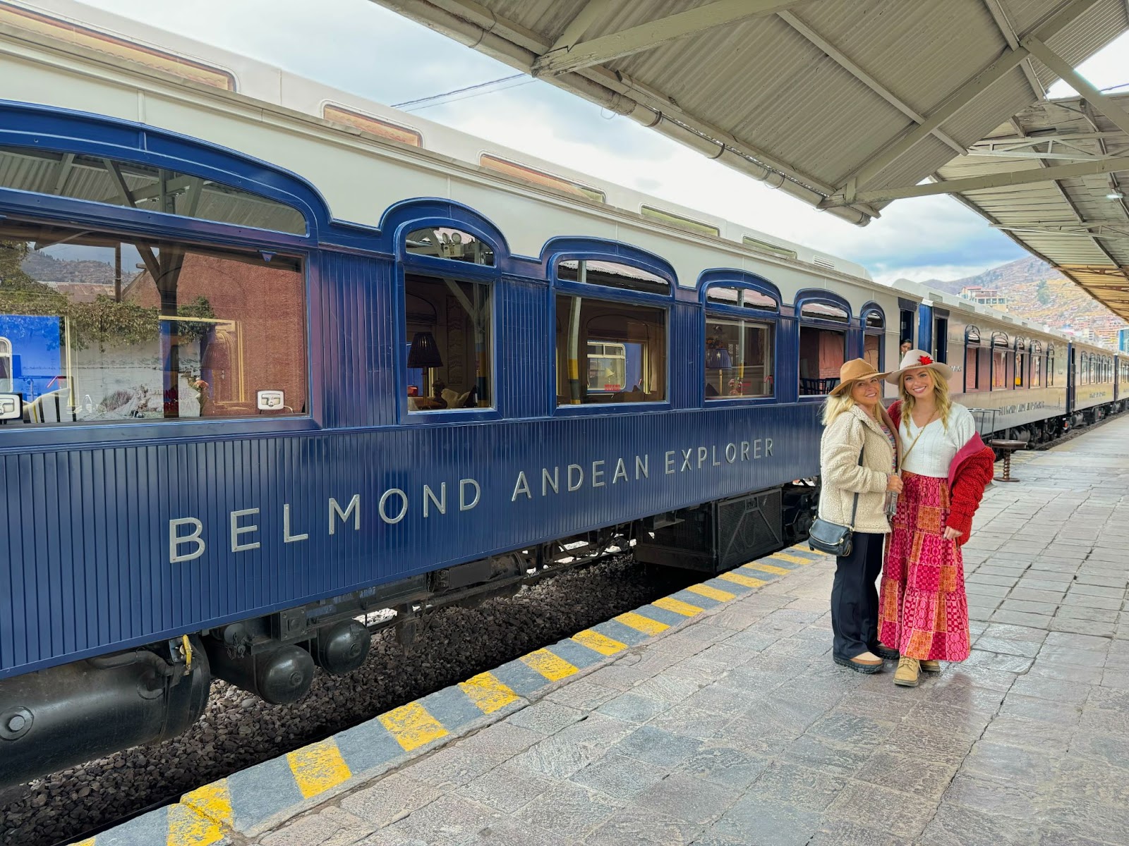 Sky and her mother infront of the Belmond Andean Explorer