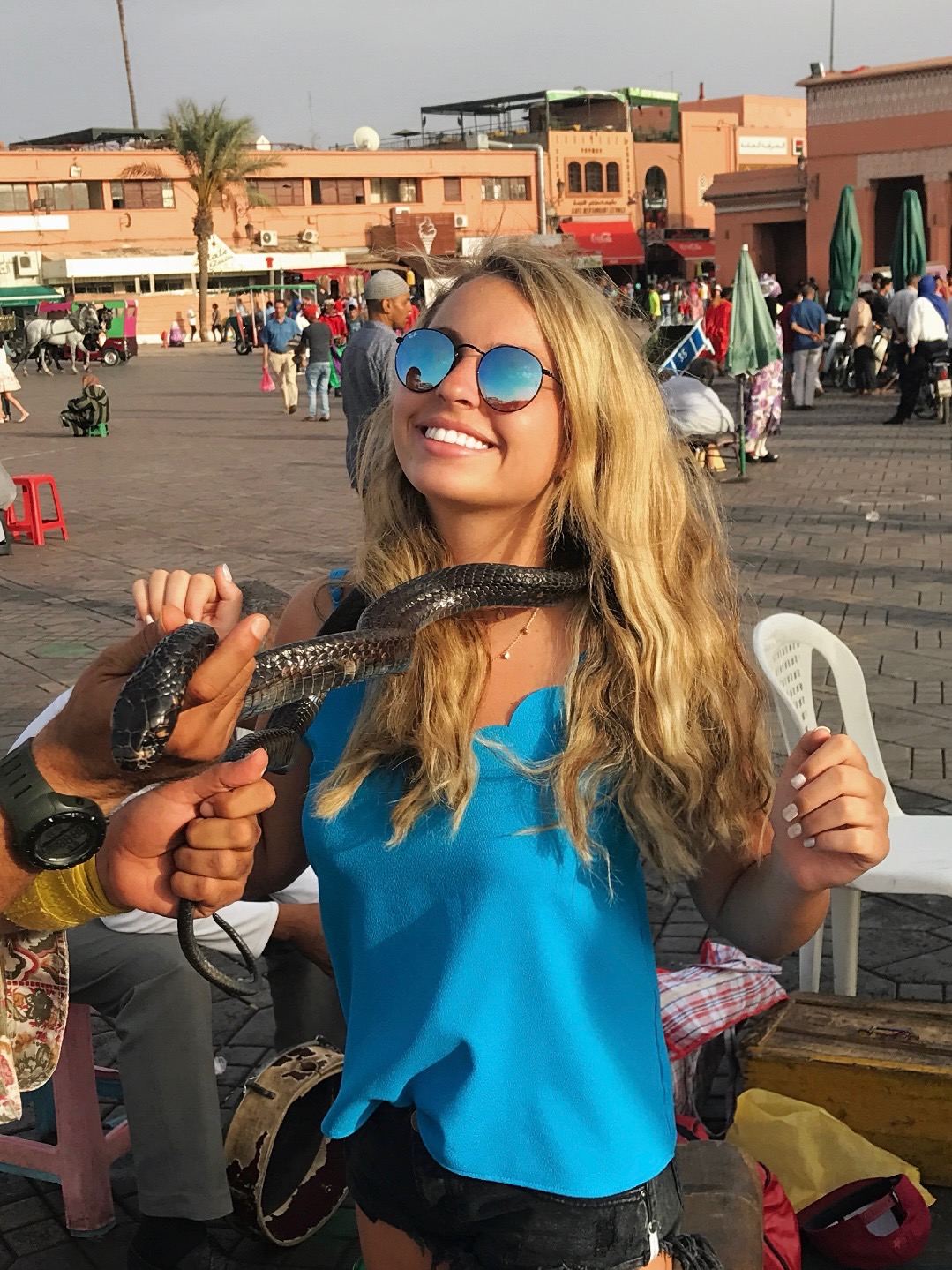 Sky with a snake around her neck in morocco